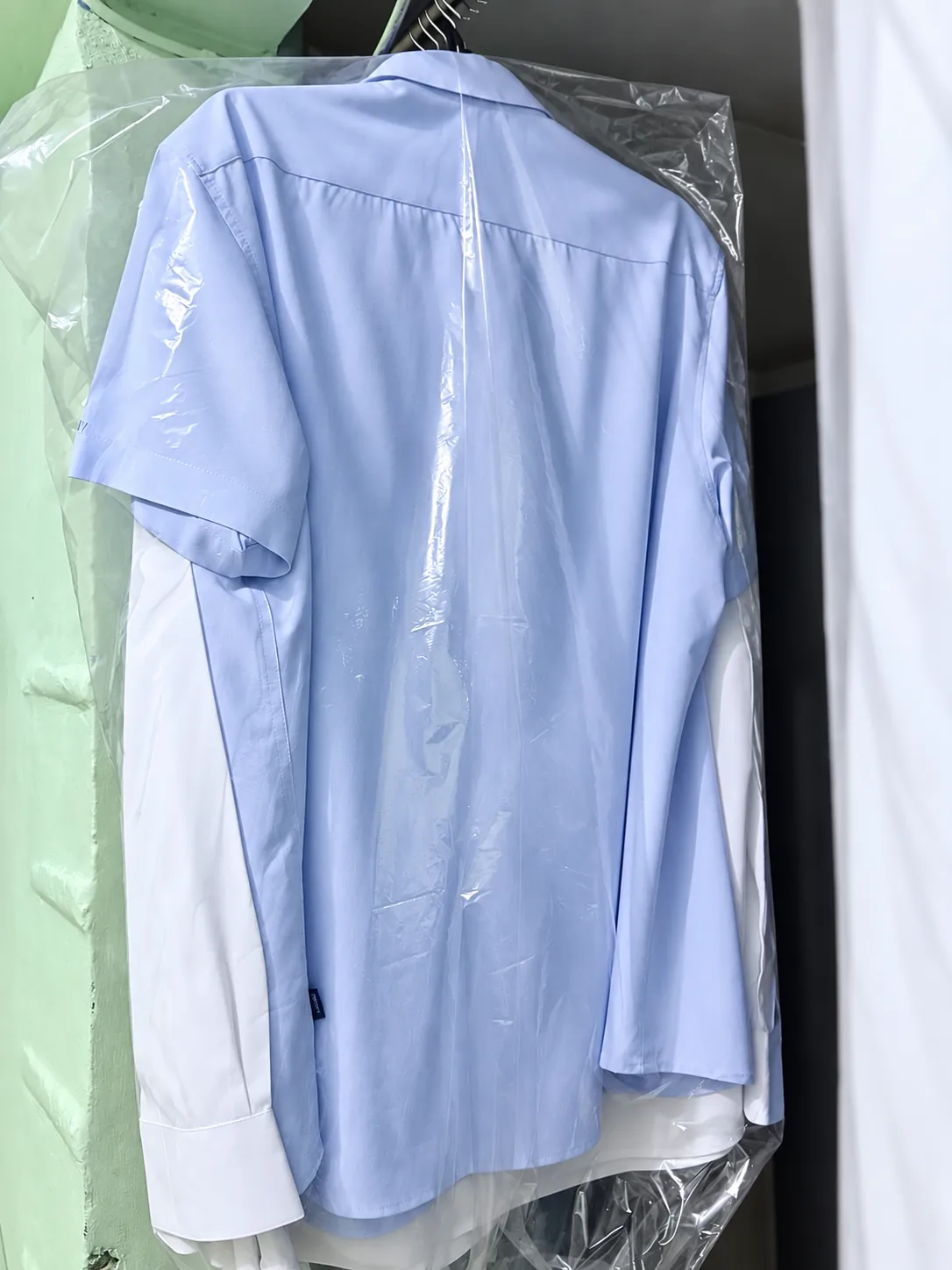 Finished shirt protected on a hanger
