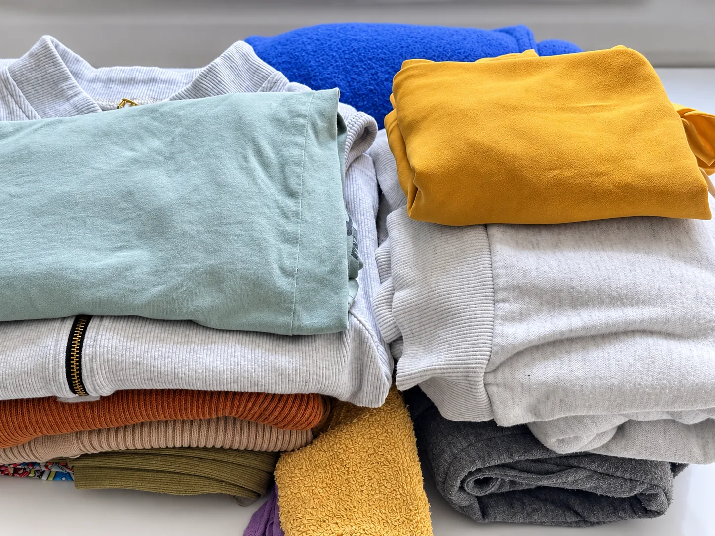 Customer clothing neatly folded after wash, dry and fold service